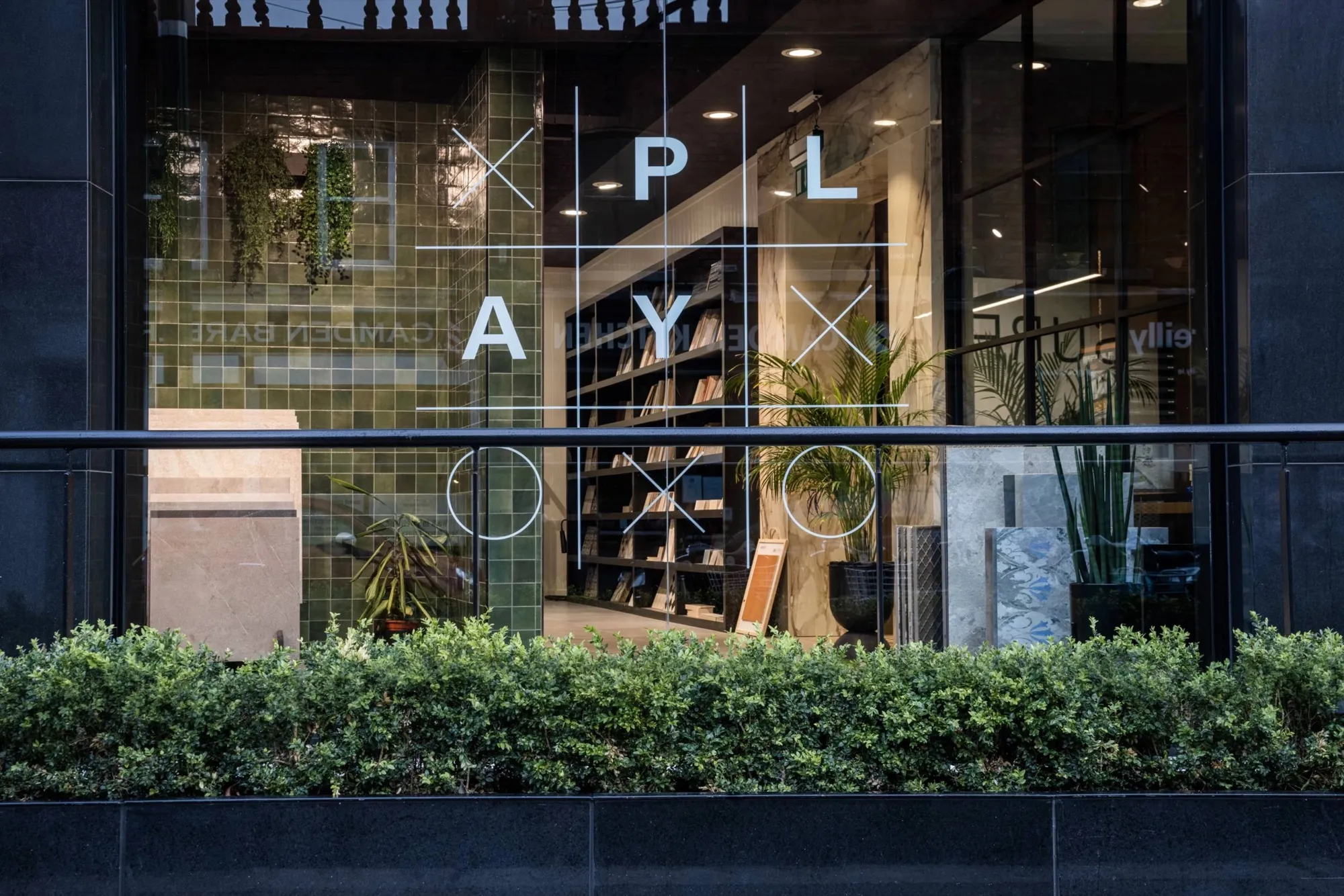 Window graphics – the modular XO grid etched on glass.