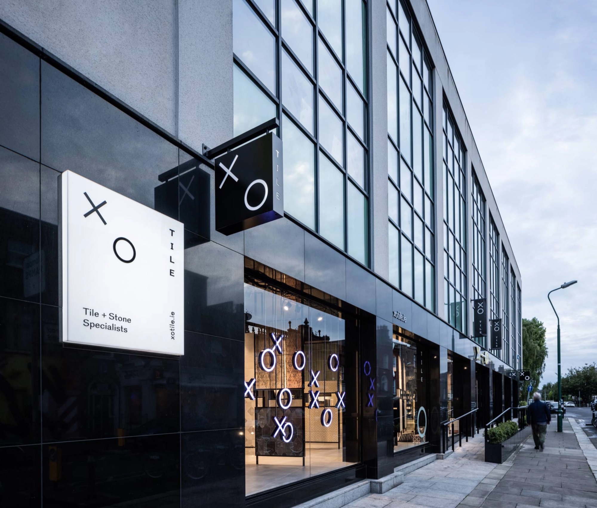 Exterior identity and projecting sign on Bow Lane.