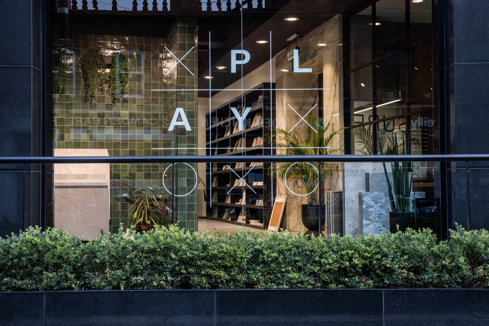 Window graphics – the modular XO grid etched on glass.